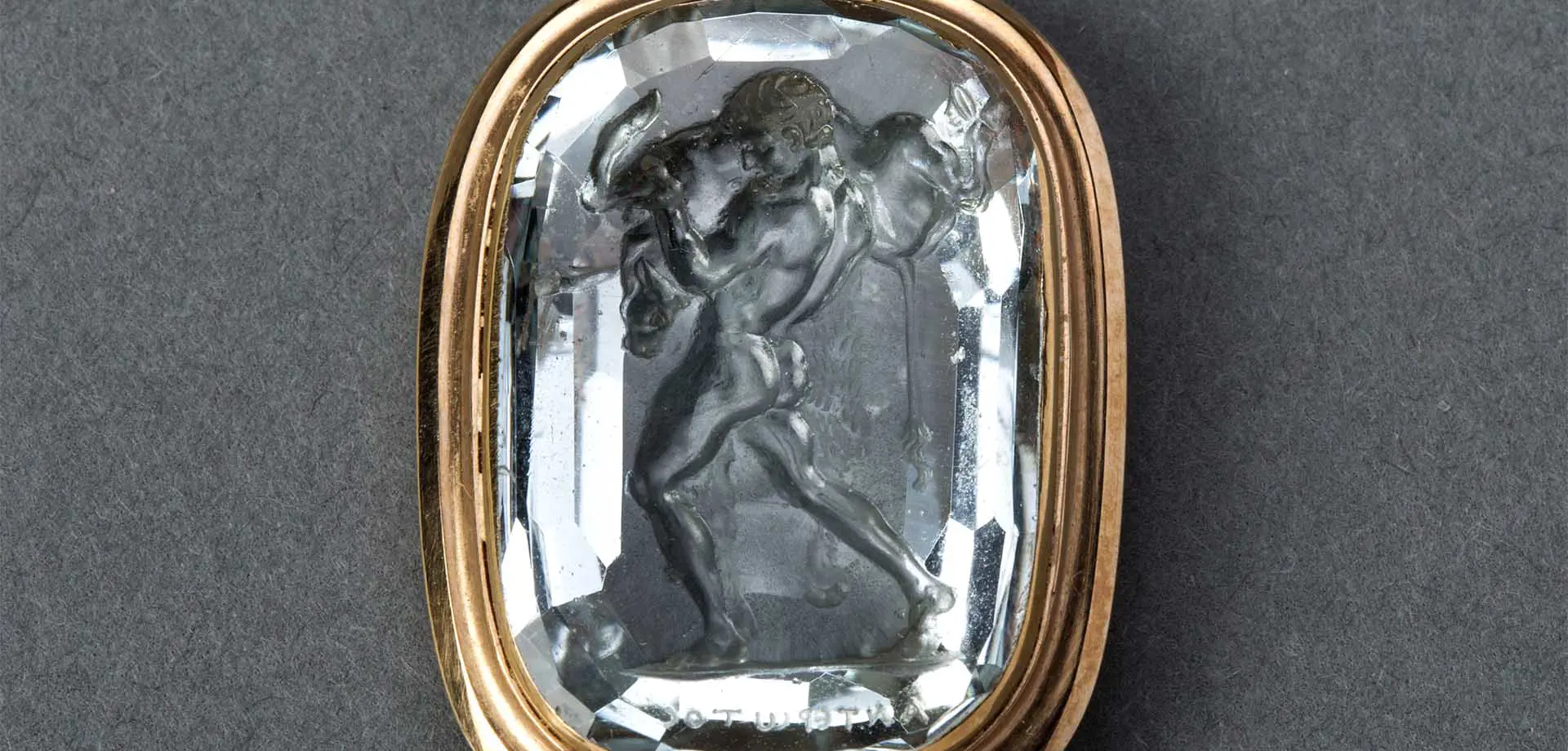 Aquamarine intaglio of a youth shouldering a bull